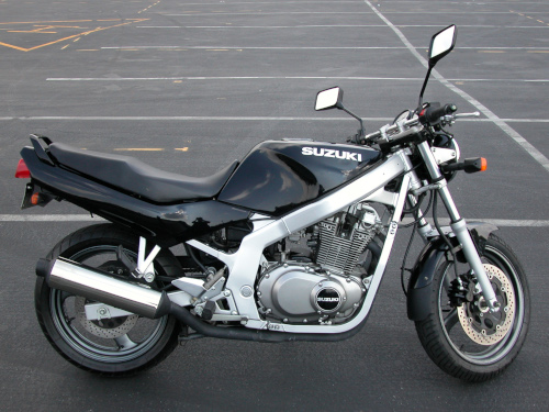 Stock photo of a motorcycle in a parking lot